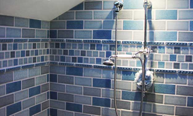 No Mold or Mildew in This Blue Tiled Bathroom Shower.