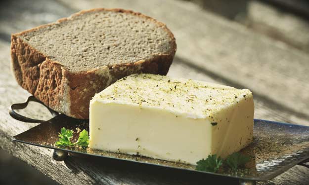 Large Cube of Seasoned Butter and Thick Sliced Bread.