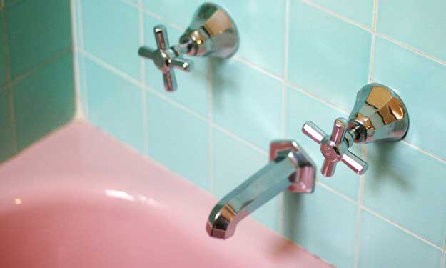 Clean Bathroom Tile Around Pink Bathtub.