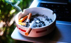 Cigarettes in an Ashtray and How to Remove the Odor from Cars.