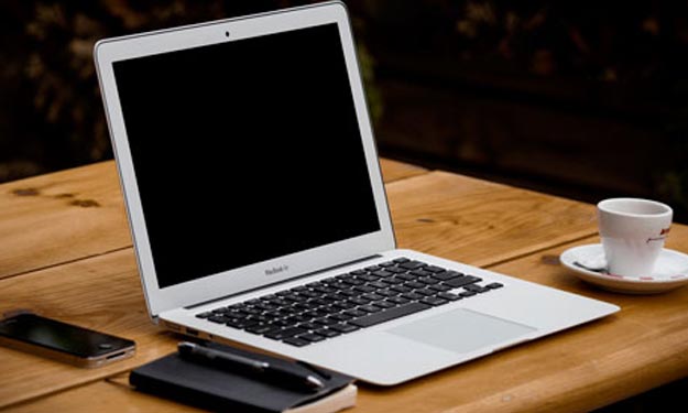 Laptop Sitting on Home Office Desk.