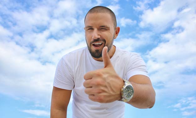 Man Giving the Thumbs Up to His Clean White Tshirt